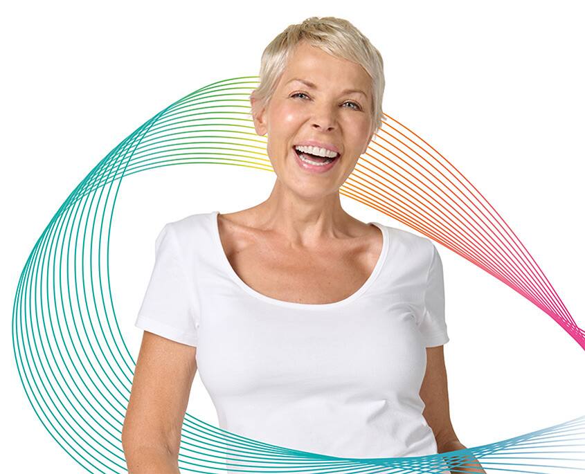 Kobiety uśmiechające się Colgate Total.